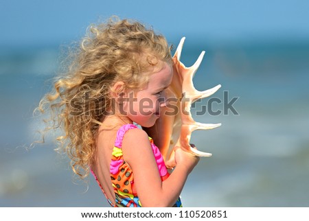 Girl of walking on the beach