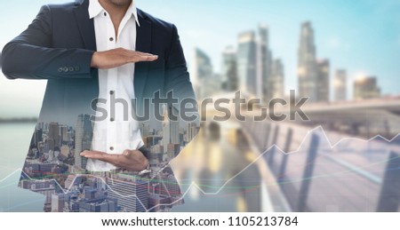 Businessman open hand for your text - Businessman opening palms making hand gestures to build copy space for your business text or logo with modern city in background.
