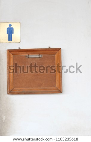 old male toilet label and wood board