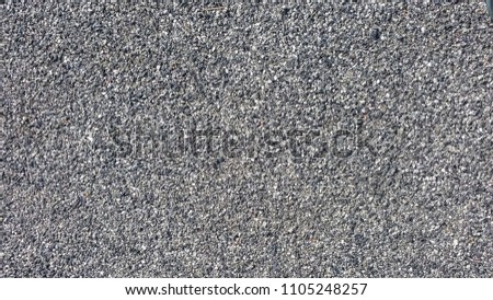 Grit stone background grey gravel (Pebble) floor texture, top view.