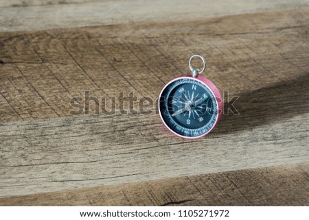 compass on wooden table