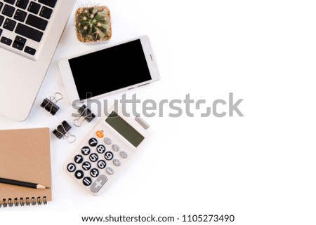 White office desk table, workspace office with laptop, smartphone black screen, pen, calculator, glasses, Top view with copy space