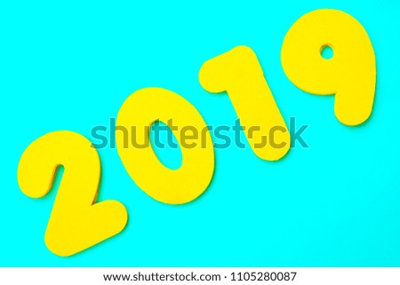 A yellow 2019 heading over a blue background.