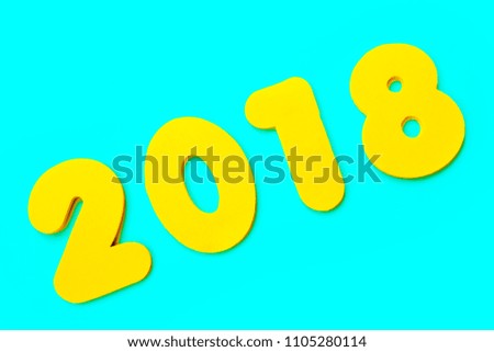 A yellow 2018 heading over a blue background.