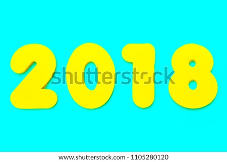 A yellow 2018 heading over a blue background.