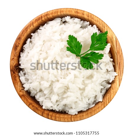 rice in a wooden bowl isolated on white background. Top view. Flat lay Royalty-Free Stock Photo #1105317755