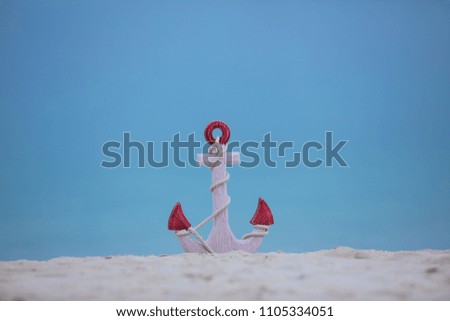 summer background, anchor on the beach sand