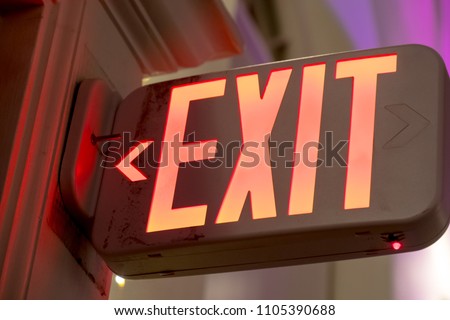 A red exit sign by the door