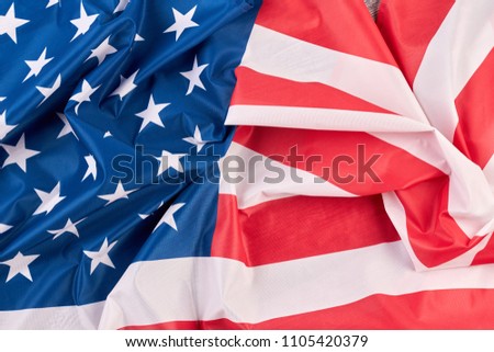 Crumpled flag of USA close up. American national flag as background.