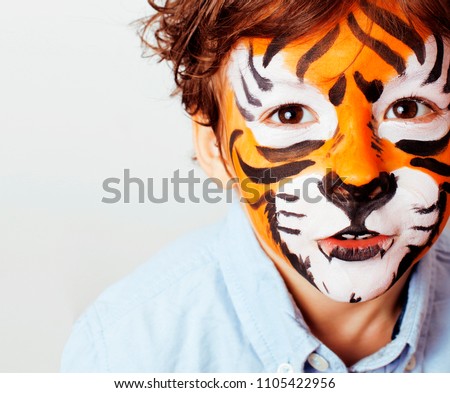 little cute boy with faceart on birthday party close up, little 