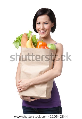 Attractive girl with the packet of fruit and vegetables, Isolated, white background. Wasting