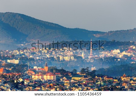 Aerial view of Da Lat city, Vietnam. Fog on top of city in the morning.
