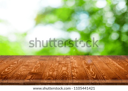 Wooden tabletop perspective for product placement or montage with focus to table. Wooden board surface.