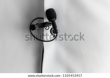 Lapel Microphone on a white shirt