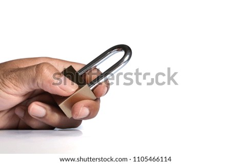 An Asian man's hand holds a lock.safety first.isolated and copy space