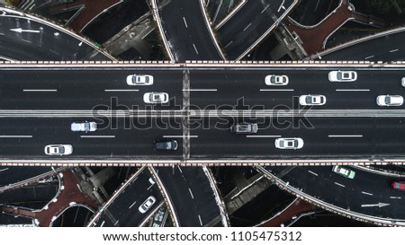 Aerial view of highway and overpass in city on a snowy day
