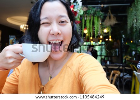 selfie Asian woman, drinking coffee and taking self portrait