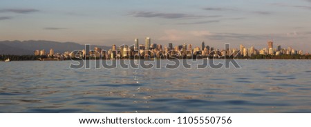 Panoramic view of Downtown City during a vibrant sunset. Taken in Vancouver, British Columbia, Canada.