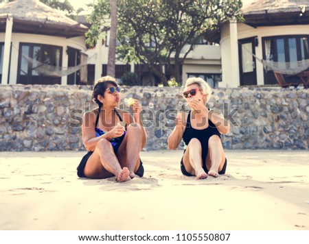 Mature women tanning on the beach