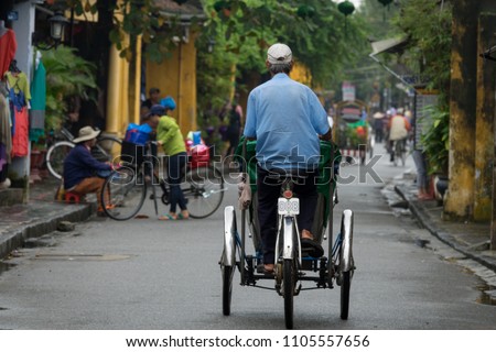 The cyclos in Hoi An old town. Stock photo of cyclo on street, cyclo is the favorite transportation in HoiAn. Hoi An ancient town is UNESCO world heritage, one of the most popular destinations in Asia
