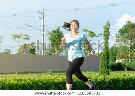 Asian woman are running to fast at garden. Asian woman running concept.
