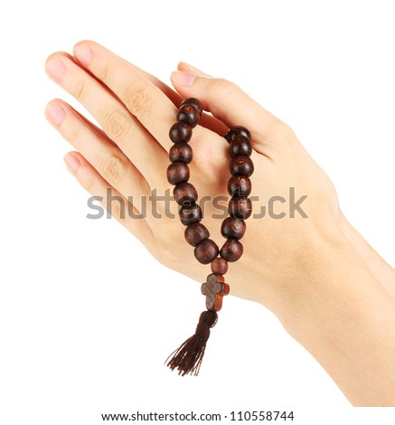 Hands in Prayer with Crucifix on white background close-up
