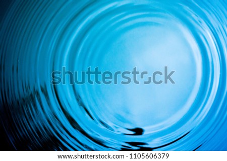 Top view Closeup blue water rings, Circle reflections in pool. Royalty-Free Stock Photo #1105606379