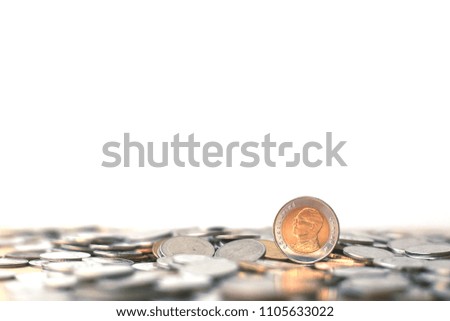 Close-up of a Thai coin lying on the floor white background selective focus and shallow depth of field