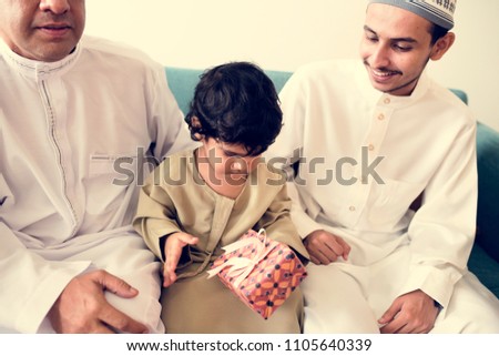 Muslim little boy with his family