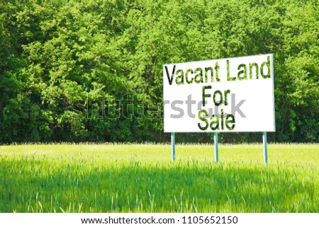 Advertising billboard immersed in a rural scene with Vacant Land for Sale written on it - image with copy space