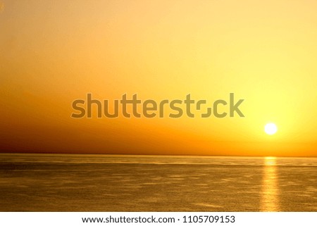 Beautiful early sunset on the sea background