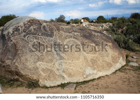 Goats carved on stone, Petroglyphs National Park near Issyk-Kul Lake, Kyrgyzstan