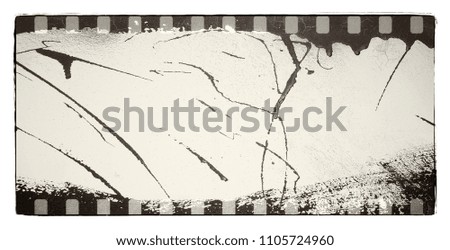 Grunge dripping film strip frame in black and white tones.