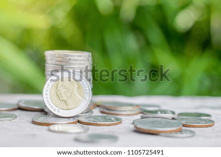 Coin on the wooden table, Money, Financial, Business Growth concept,Saving money for retirement planning.