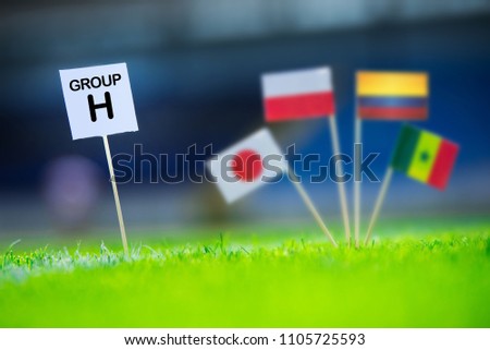 Group H - National flags of Poland, Senegal, Columbia, Japan in , edit space. Table with title "Group H" National flags in background Royalty-Free Stock Photo #1105725593
