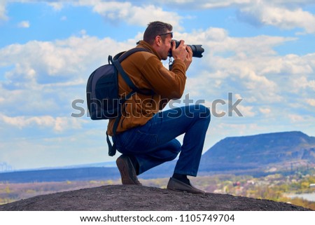 a man with a camera in his hands