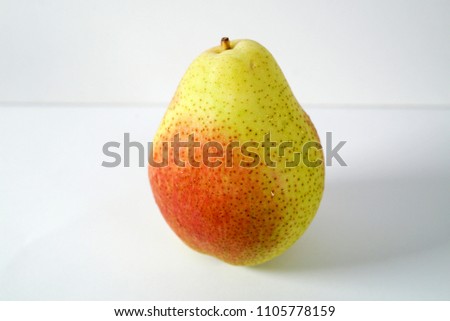 Pear, an edible fruit produced by the pear tree, similar to an apple but elongated towards the stem. 