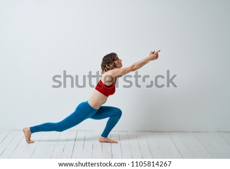 fitness trainer doing sports on the wooden floor                             