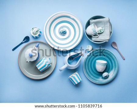 Blue pastel ceramic tableware crockery set on abstract background Royalty-Free Stock Photo #1105839716