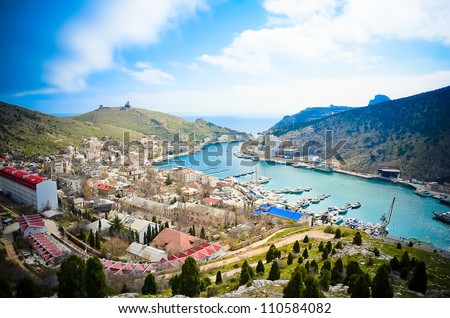 Bird-eye look of  Balaklava in Crimea, view on beautiful bay over mountains Royalty-Free Stock Photo #110584082