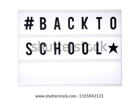 Back to school text in a light box. Box isolated over white background. A sign with a message
