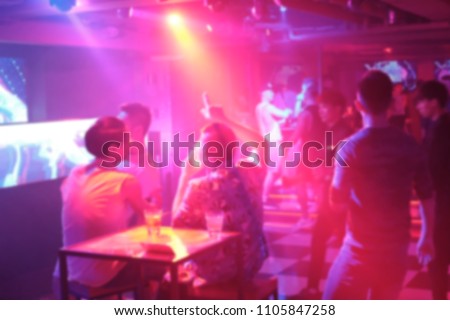 Abstract and blurred image of people drinking and dancing in the night club, photoed in Taipei 