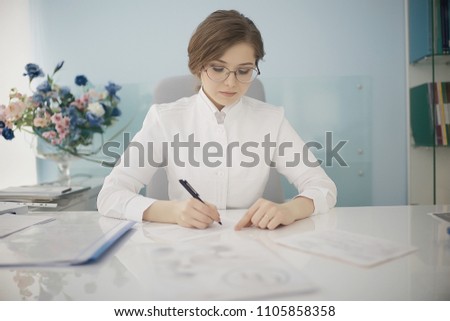 female pediatrician / doctor at work in clinic, concept of female child doctor in modern medical clinic