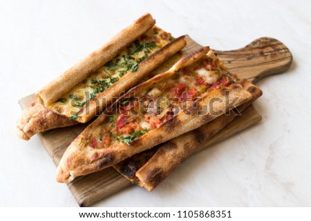 Turkish Pastry Konya Mevlana Pide with Cubed Meat and Melted Cheese. Traditional Food.