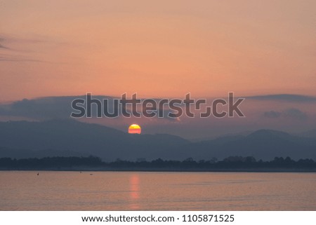 sunset behind mountain