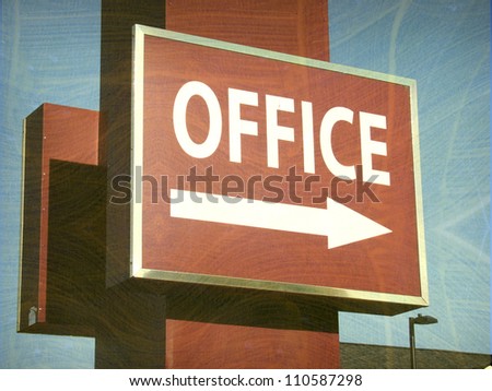 aged and worn vintage photo of office sign with arrow