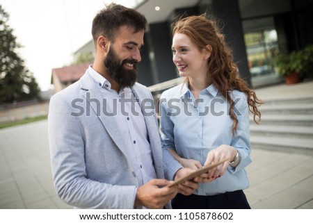 Picture of handsome man and beautiful woman as business partners