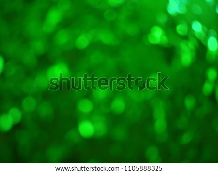 Green out of focus festive lights with abstract background of green color. Green color is considered auspicious on the occasion of Ramadan and Eid festival in Islam religion. Good for month of Ramadan