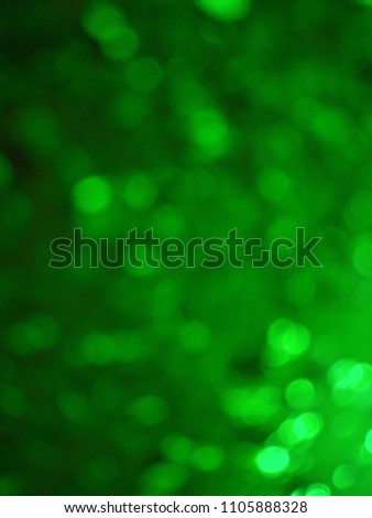 Green out of focus festive lights with abstract background of green color. Green color is considered auspicious on the occasion of Ramadan and Eid festival in Islam religion. Good for month of Ramadan