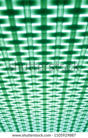 The contrast green geometric pattern background or texture. Square elements  and the lines in the white light. Abstract phote resemble the fabric structure